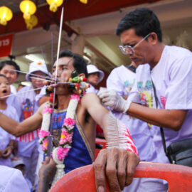 The piercing ritual with spikes and needles in progress, at the Lim Hu Tai Su Shrine during the Phuket Vegetarian Festival; photo by Ivan Kralj.