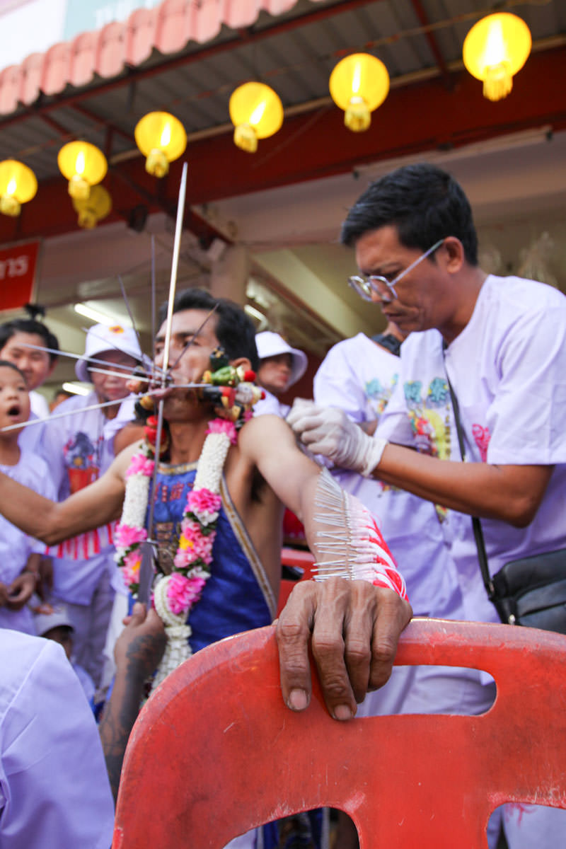 The piercing ritual with spikes and needles in progress, at the Lim Hu Tai Su Shrine during the Phuket Vegetarian Festival; photo by Ivan Kralj.