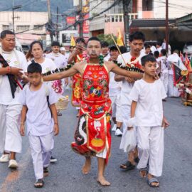 Ma song participant of the Phuket Vegetarian Festival, his face and arms pierced with spikes, walking in the procession from the Lim Hu Tai Su Shrine, Thailand; photo by Ivan Kralj.
