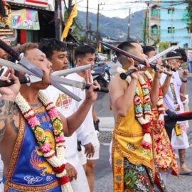 Ma song participants of the Phuket Vegetarian Festival, their faces pierced with swords, walking in the procession from the Lim Hu Tai Su Shrine, Thailand; photo by Ivan Kralj.