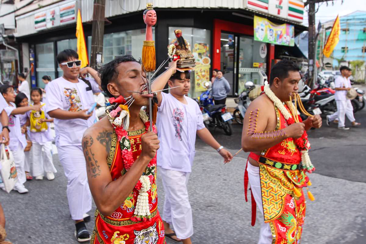 Ma song participants of the Phuket Vegetarian Festival, their faces pierced with spikes and ropes, walking in the procession from the Lim Hu Tai Su Shrine, Thailand; photo by Ivan Kralj.