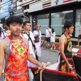 Ma song participant of the Phuket Vegetarian Festival, his face pierced with spikes, walking in the procession from the Lim Hu Tai Su Shrine, Thailand; photo by Ivan Kralj.