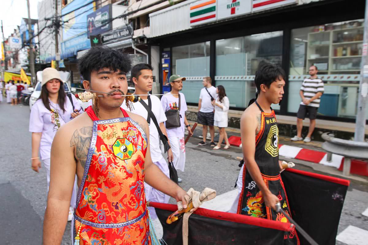 Ma song participant of the Phuket Vegetarian Festival, his face pierced with spikes, walking in the procession from the Lim Hu Tai Su Shrine, Thailand; photo by Ivan Kralj.