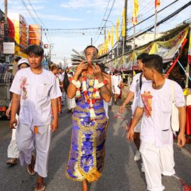 Ma song, spirit medium of the Phuket Vegetarian Festival, his face pierced with sickles, walking in the procession from the Lim Hu Tai Su Shrine, Thailand; photo by Ivan Kralj.