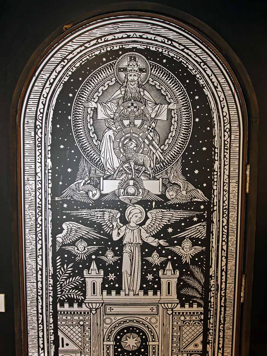 Medieval-tarot-style illustration on an arched door of a hostel room in Shade House - Phuket Downtown, Thailand; photo by Ivan Kralj.