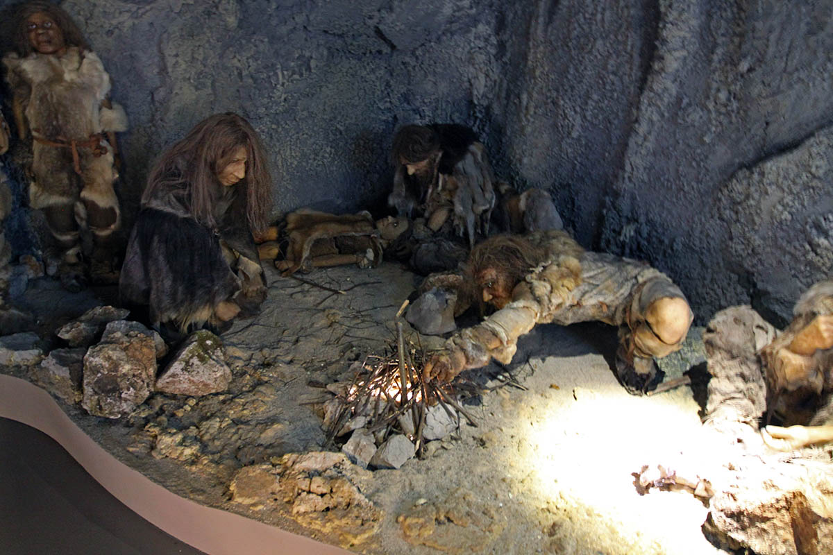 A museum diorama of cave men on the territory of today's Slovenia setting up fire, as displayed at Expo Postojna Cave Karst exhibition; photo by Ivan Kralj.