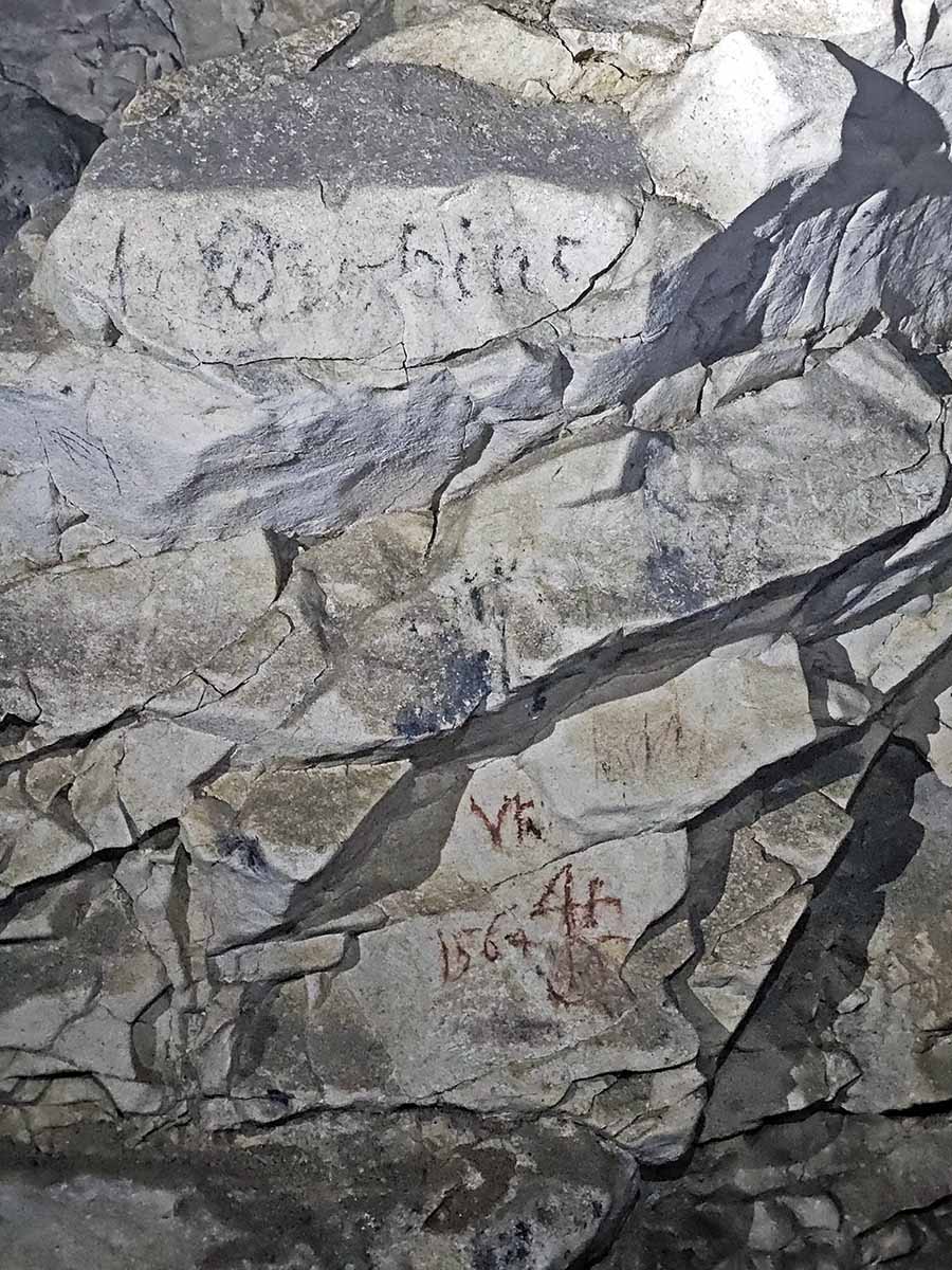 A signature on the wall of the Cave under Predjama Castle, the so-called Cave of Names, mentioning the year 1564 - visitors have been leaving autographs here since the 15th century; photo by Ivan Kralj.