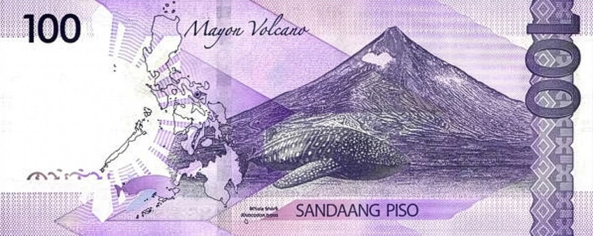 The back side of the 100 piso bill (PHP) in the Philippines, depicting Mayon Volcano and a whale shark; photo by Vintage Printery.