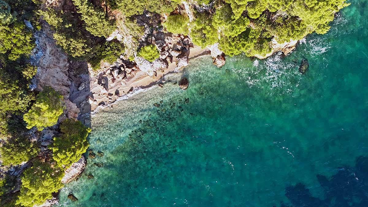Aerial view of Blato FKK Beach on Makarska Riviera, Croatia; drone photo by Ivan Kralj.