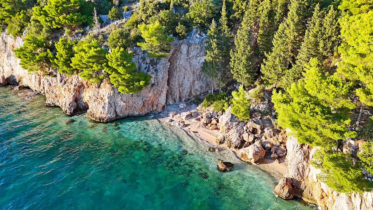 Aerial view of Blato FKK Beach, the best nudist beach on Makarska Riviera, Croatia; drone photo by Ivan Kralj.
