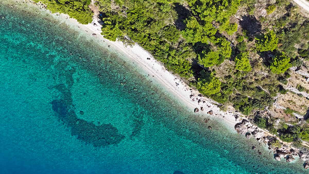 Aerial view of Jarsan, FKK beach in Igrane, on Makarska Riviera, Croatia; photo by Ivan Kralj.
