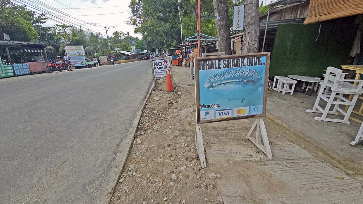 The roadside banner promoting Oslob whale shark dive, accepting a variety of paying methods, from PayPal to credit cards; photo by Ivan Kralj.