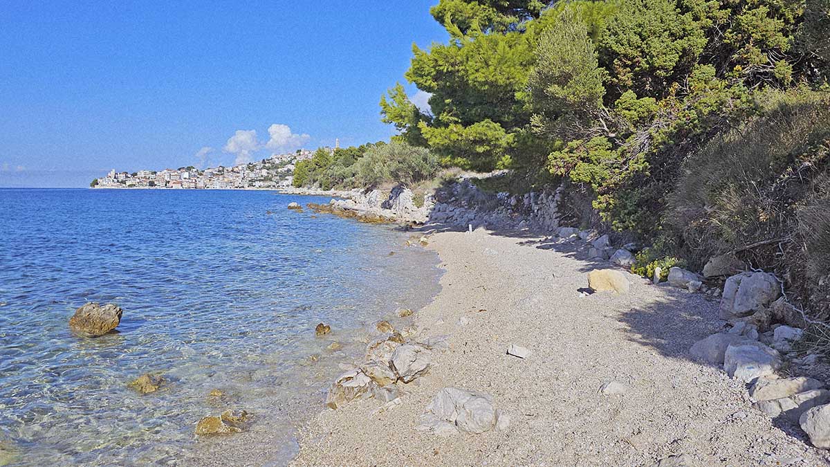 Živogošće West FKK Beach with the view of the neighboring village of Igrane, a naturist oasis on Makarska Riviera, Croatia; photo by Ivan Kralj.