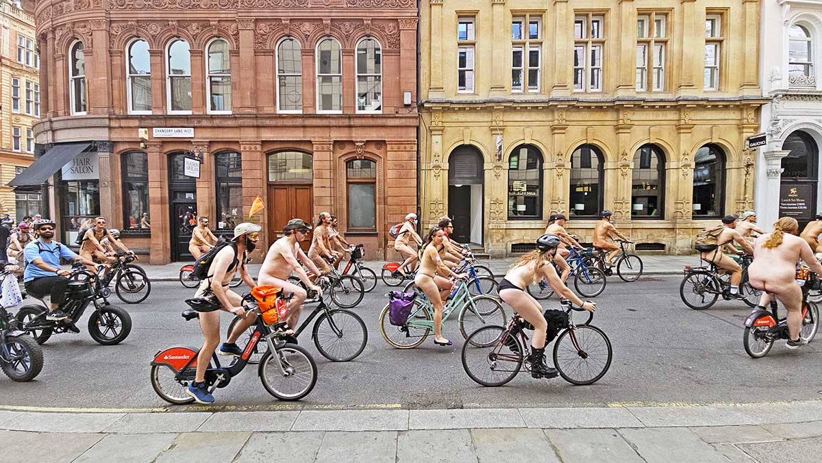 Nude cyclists riding bicycles through London downtown during the World Naked Bike Ride event; photo by Ivan Kralj.