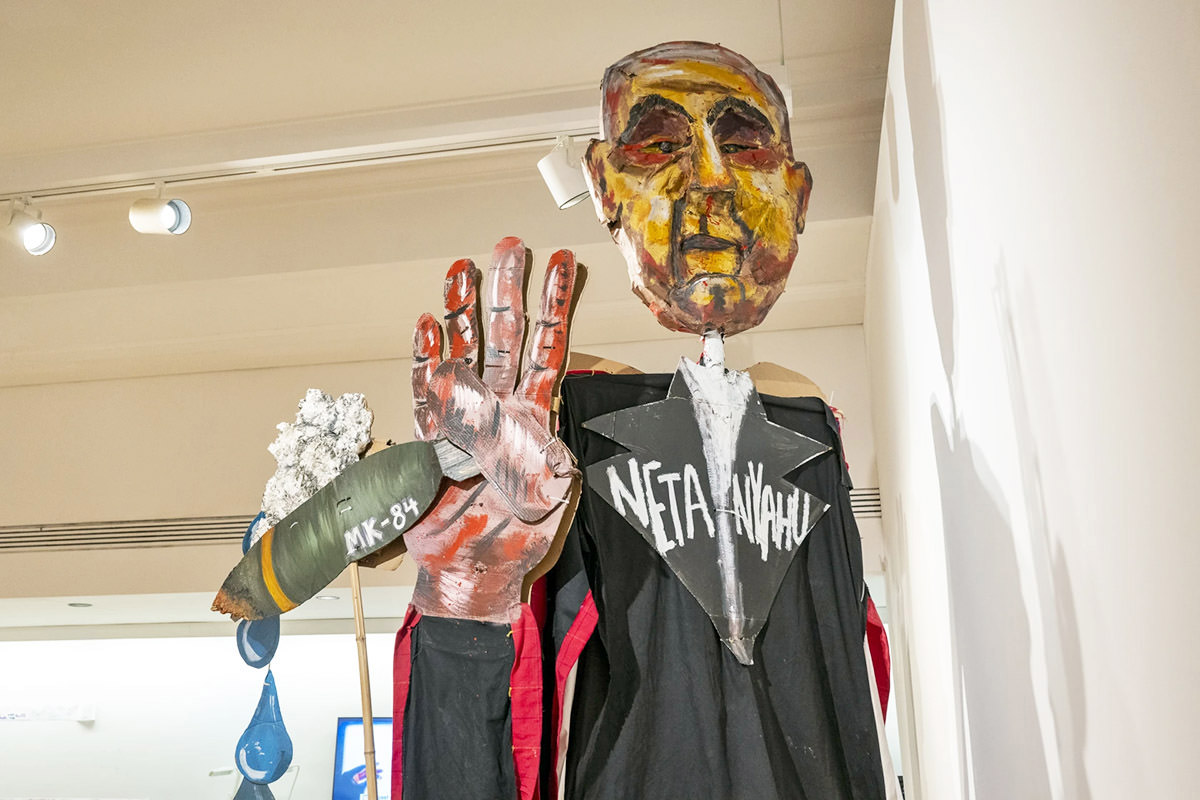 Puppet of Netanyahu clutching a bloodied MK-84 bomb, as presented at Chicago Cultural Center in 2025, by Chicago-Based Protest Puppeteers (artistic director Abby Palen); “US-Israel War Machine” art installation was attacked as antisemitic - photo by Tyler Pasciak Lariviere, Sun Times.